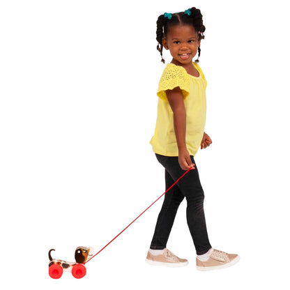 Lifestyle shot of girl pulling the Fisher-Price Little Snoopy