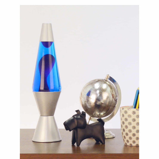 14.5” LAVA® Lamp – Purple/Blue/Silver on table with scotty dog figure, silver globe, and a pencil cup