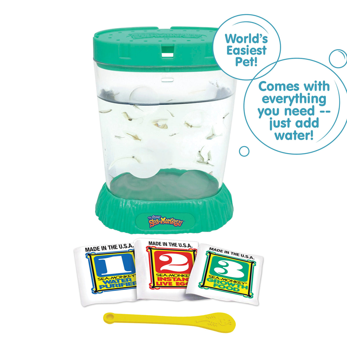 A teal aquarium is filled with water and Sea-Monkeys. Laying in front, there are three packets, numbered 1, 2, and 3 from left to right. There is a small yellow Sea-Monkeys spoon laying in front of the packets. There are two callouts in circles. One reads "World's Easiest Pet!" and the other reads "Comes with everything you need - just add water!"