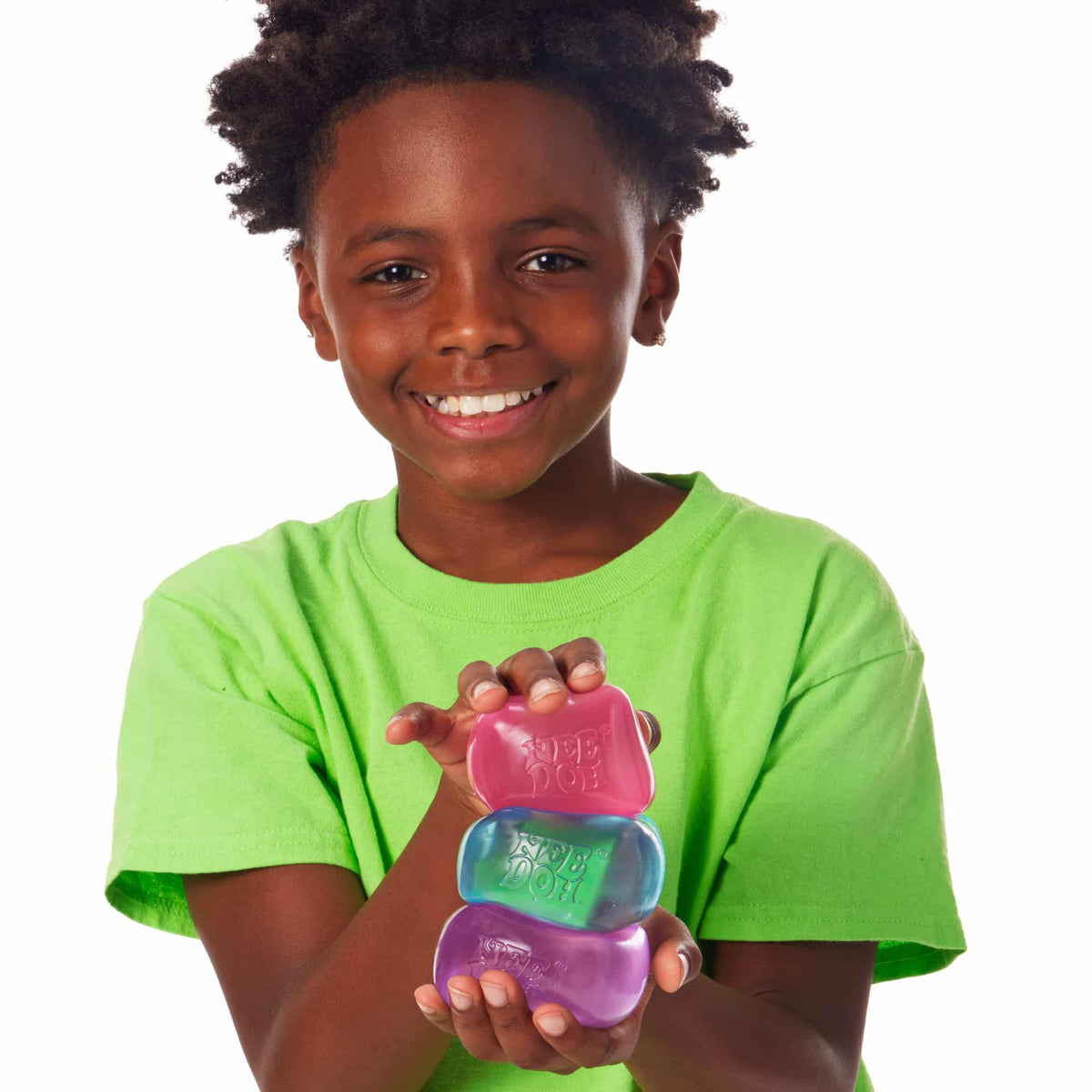 NeeDoh Nice Cube Lifestyle of boy squeezing Nice Cube stack