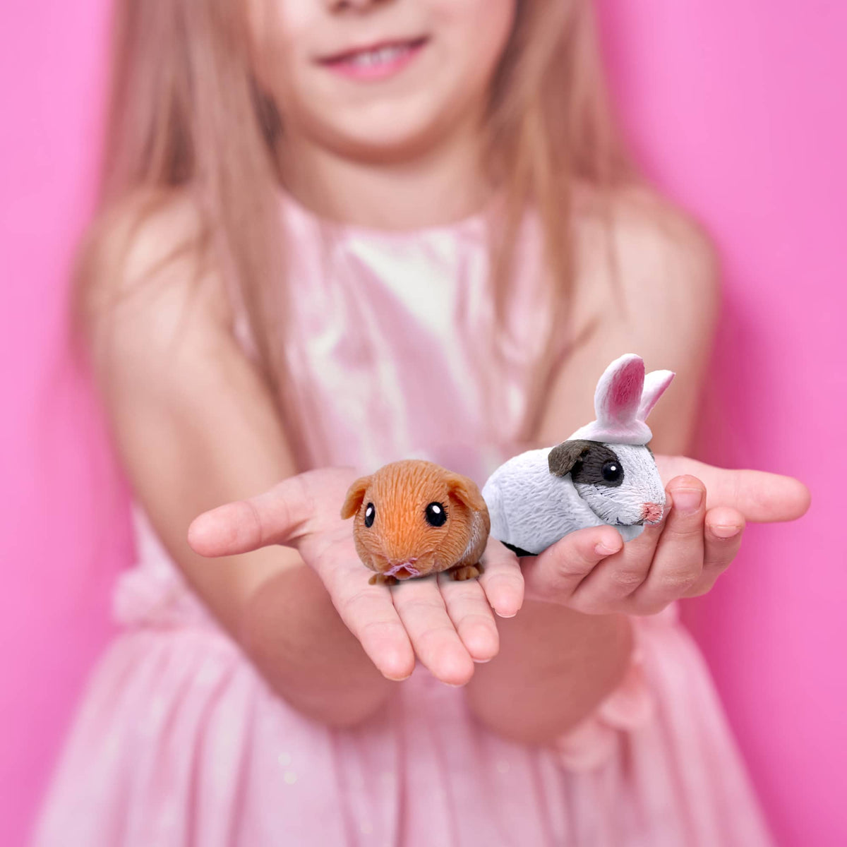squishy Guinea pig toys in a girls hands